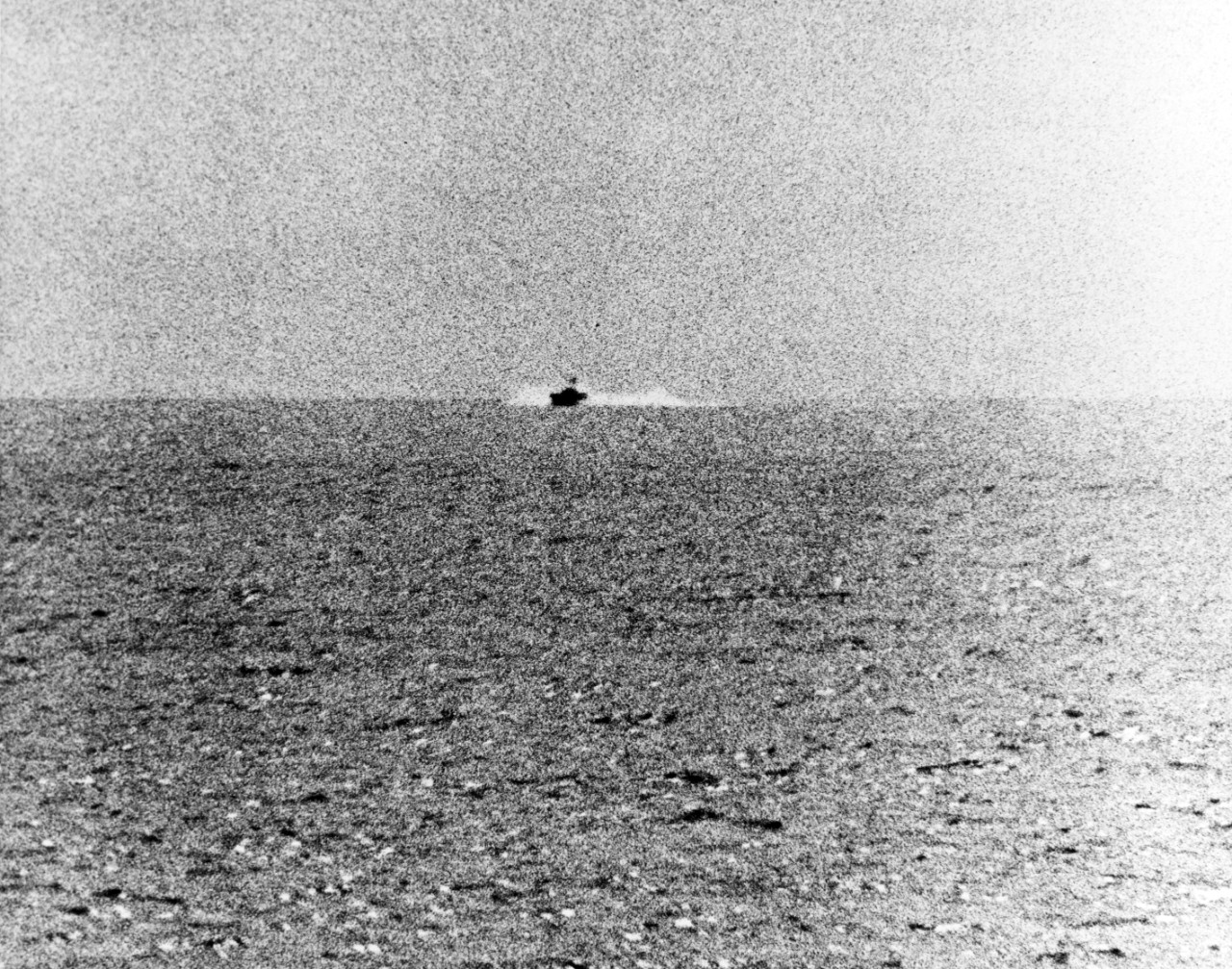 Photograph taken from USS Maddox (DD-731) during her engagement with three North Vietnamese motor torpedo boats in the Gulf of Tonkin, 2 August 1964. The view shows one of the boats speeding towards the Maddox. Official U.S. Navy Photograph.