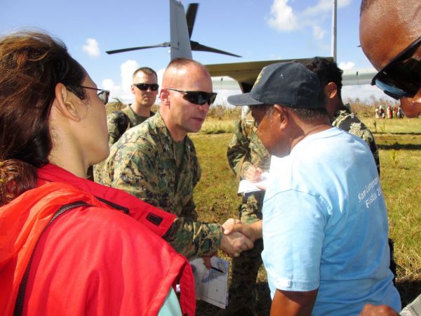 Col. John E. Merna, commanding officer of the 31st Marine Expeditionary Unit, assists Angel Pana, of the Philippine Department of Social Welfare and Development, and members of the Armed Forces of the Philippines in talking with local leadership and checking the needs of a small village destroyed in Typhoon Haiyan. A bilateral assessment team, composed of U.S. Marines, Philippine DSWD, and members of the Armed Forces of the Philippines, landed in an MV-22B Osprey to determine needs and deliver relief to remote areas in and near Leyte to assess the needs of people isolated by the storm. U.S. military assets have delivered relief supplies provided by the U.S. Agency for International Development since the start of Operation Damayan, in support of the Government of the Philippines in the wake of Typhoon Haiyan.ment, Marine Rotational Force-Darwin 22, establish defensive positions as MV-22 Ospreys approach for landing during an airfield seizure event as part of exercise Koolendong 22 at Royal Australian Air Force Base Curtin, WA, Australia, July 18, 2022. Exercise Koolendong 22 is a combined and joint force exercise focused on expeditionary advanced base operations conducted by U.S. Marines, U.S. Soldiers, U.S. Airmen, and Australian Defence Force personnel. (U.S. Marine Corps photo by Cpl. Cedar Barnes)